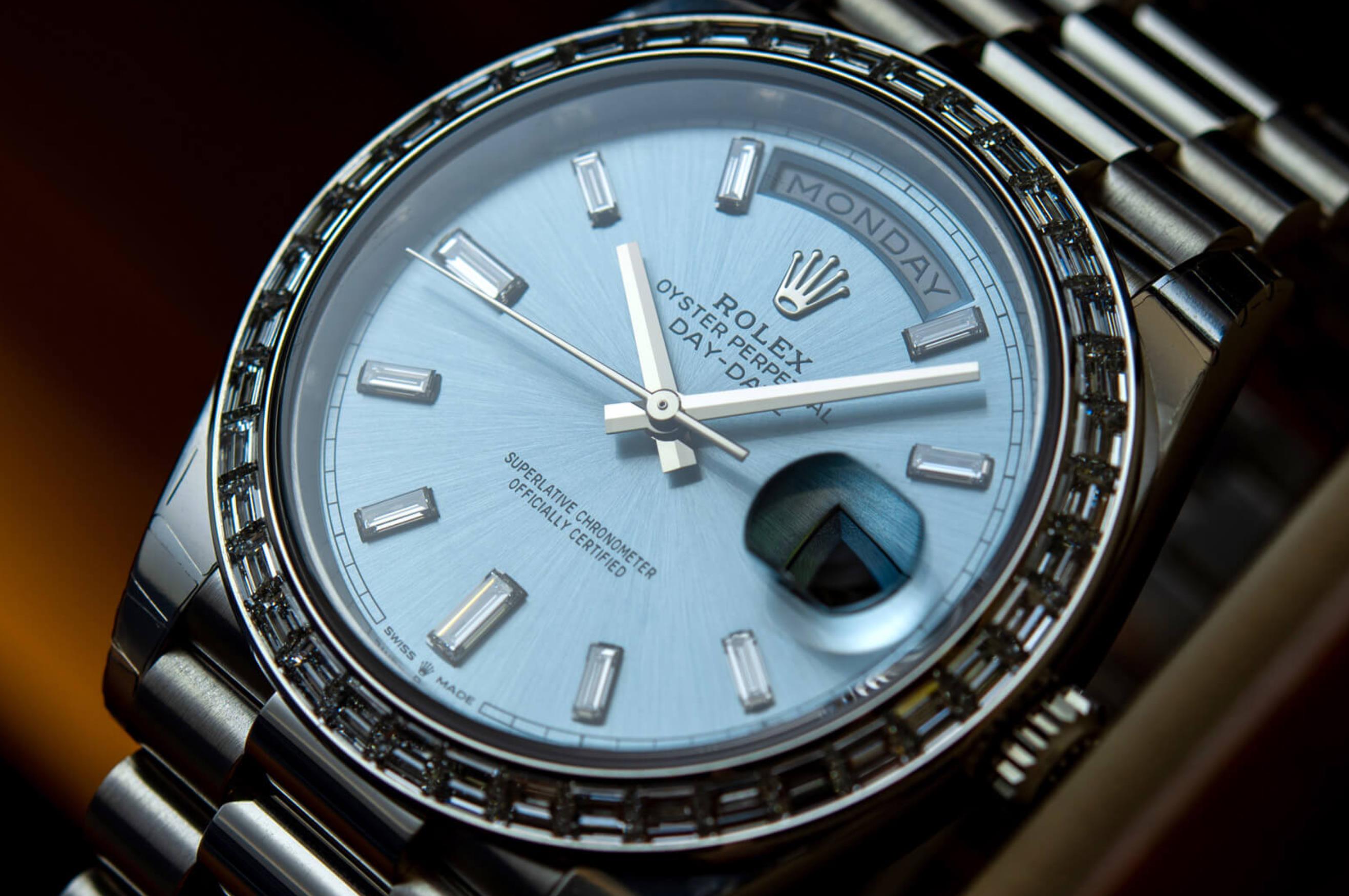 The 40mm fake watch has an ice blue dial.